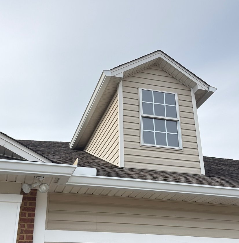 White fascia and trim finished around a dormer window