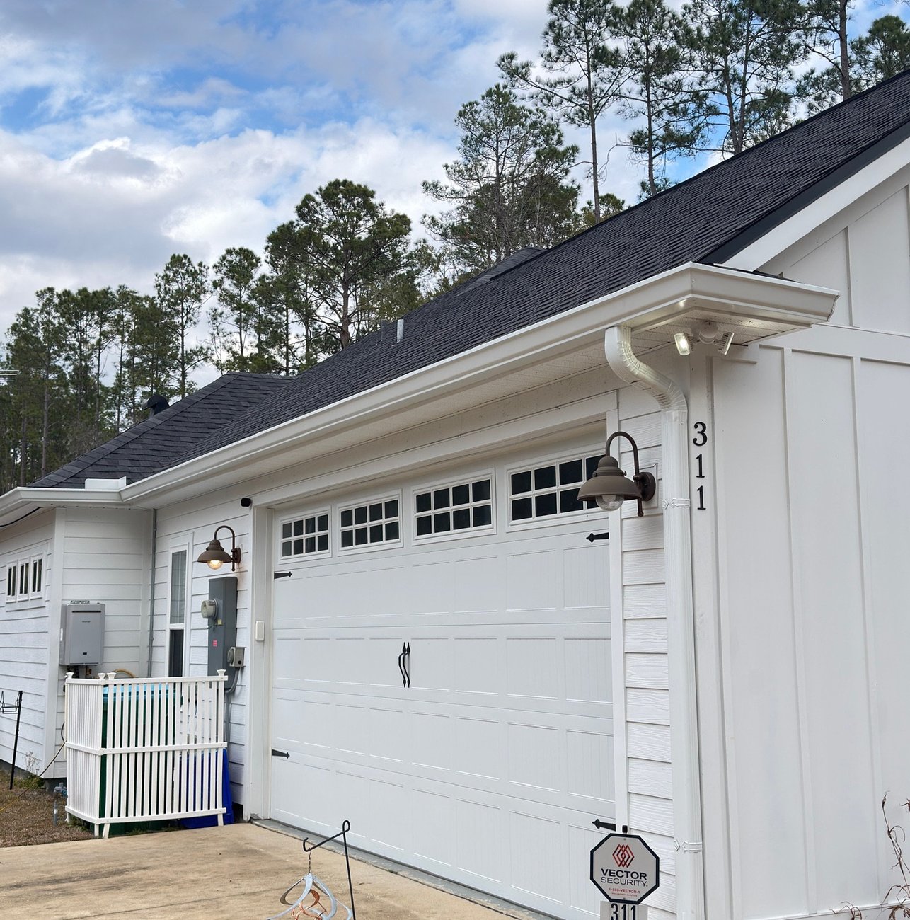 Seamless gutter directing rainwater away from a home's foundation